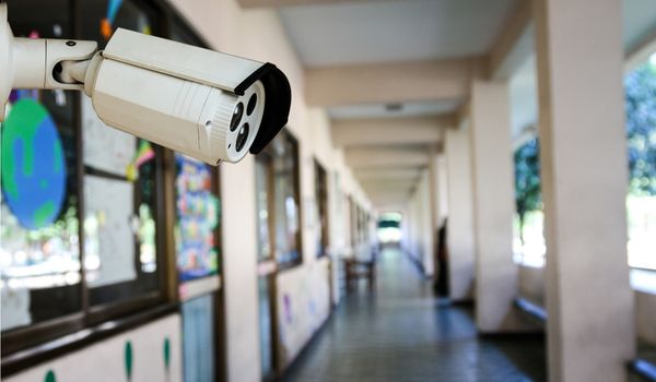 Security camera in school hallway
