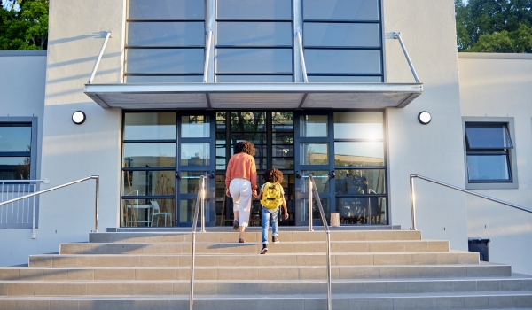 School, education and mother walking with child in morning for learning, child development and class
