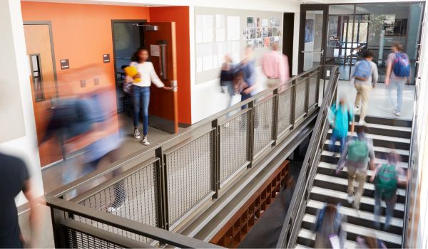 Students and staff walking around in school
