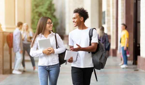 Two students on walking on campus