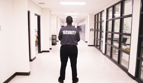 Security guard in school hallway