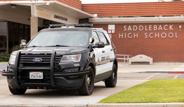 Santa Ana, California, USA - January 25, 2025: A Santa Ana police department cruiser stands watch outside of public Saddleback High School.