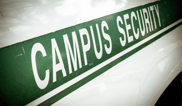 Green Campus Security banner on white vehicle