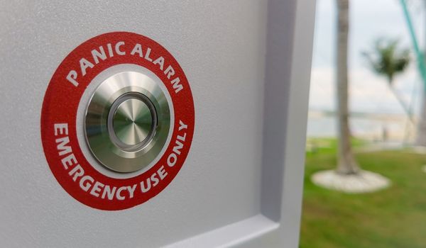 Wall attached panic alarm button