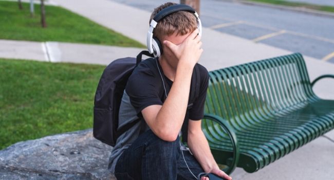 student with head in hands
