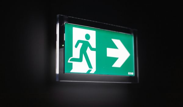 green emergency exit sign